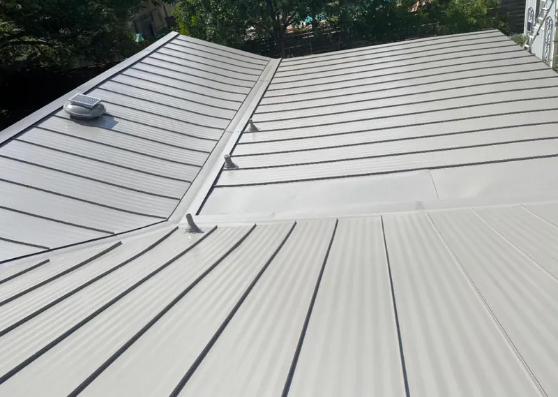 Solar attic fan installed on a metal roof for Roof Ventilation in Pantops
